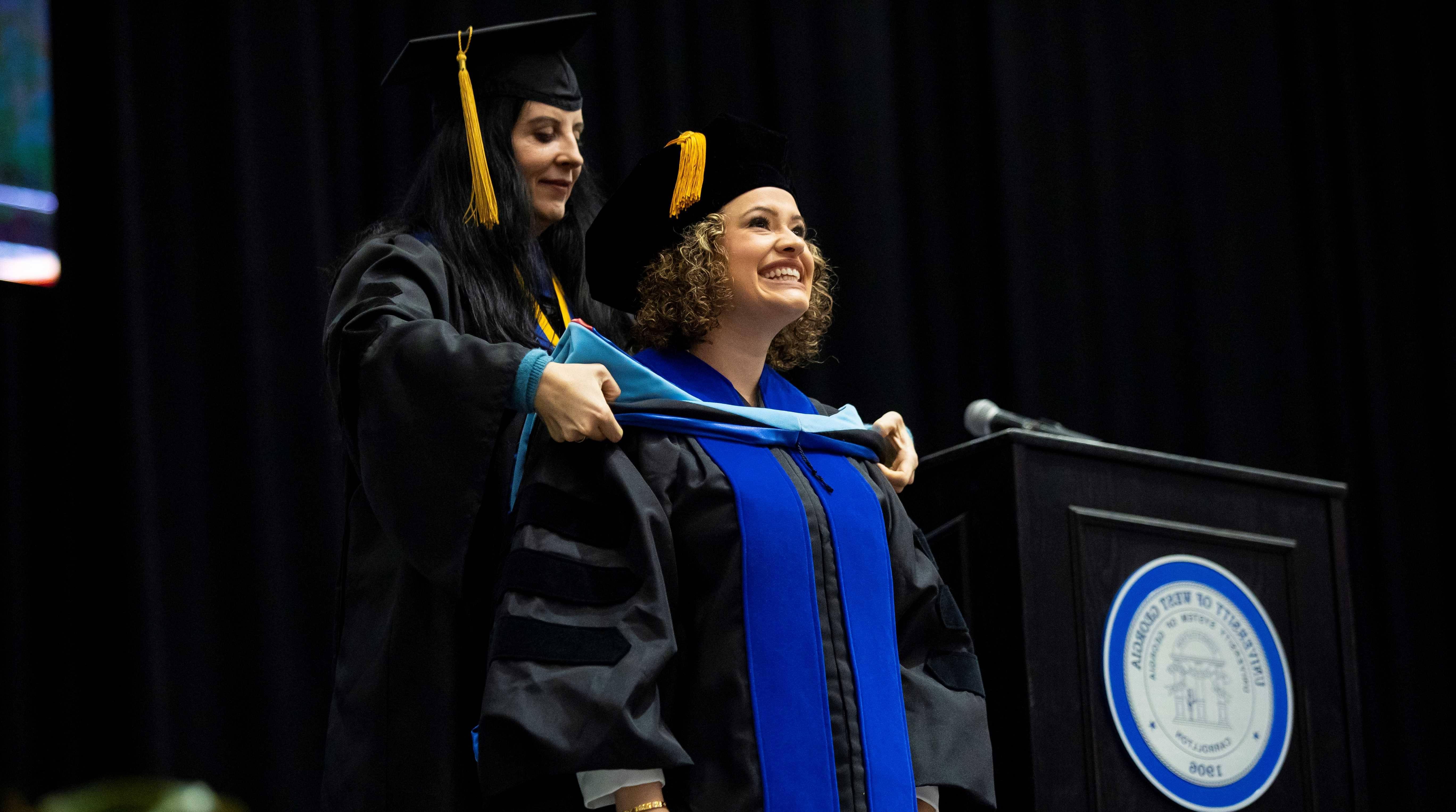 student receiving doctoral hooding