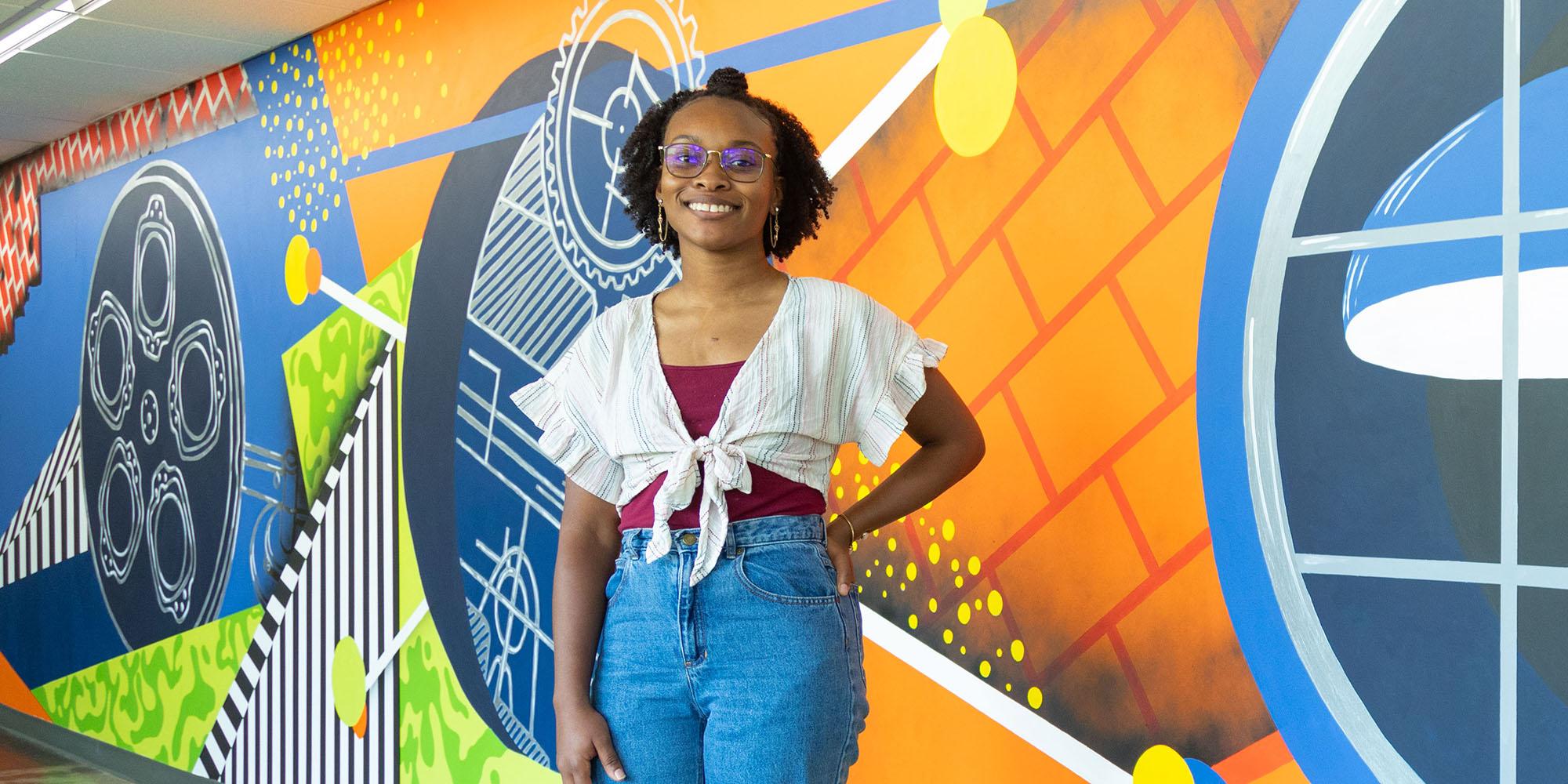 Ariana Culver in front of Newnan mural